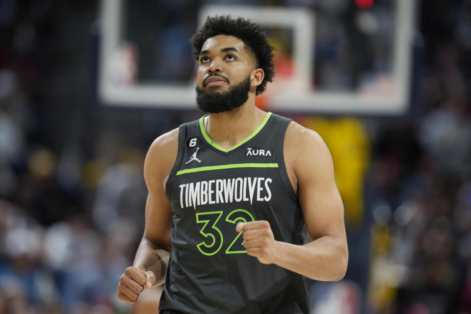 FILE - Minnesota Timberwolves center Karl-Anthony Towns looks on in the second half of Game 5 of an NBA basketball first-round playoff series against the Denver Nuggets, April 25, 2023, in Denver. Towns missed 52 games to injury last season during Rudy Gobert's debut, turning Minnesota's experiment of pairing two big men together into a false start. The Timberwolves are banking on Gobert being more comfortable in his second year and Towns staying healthy. (AP Photo/David Zalubowski, File)