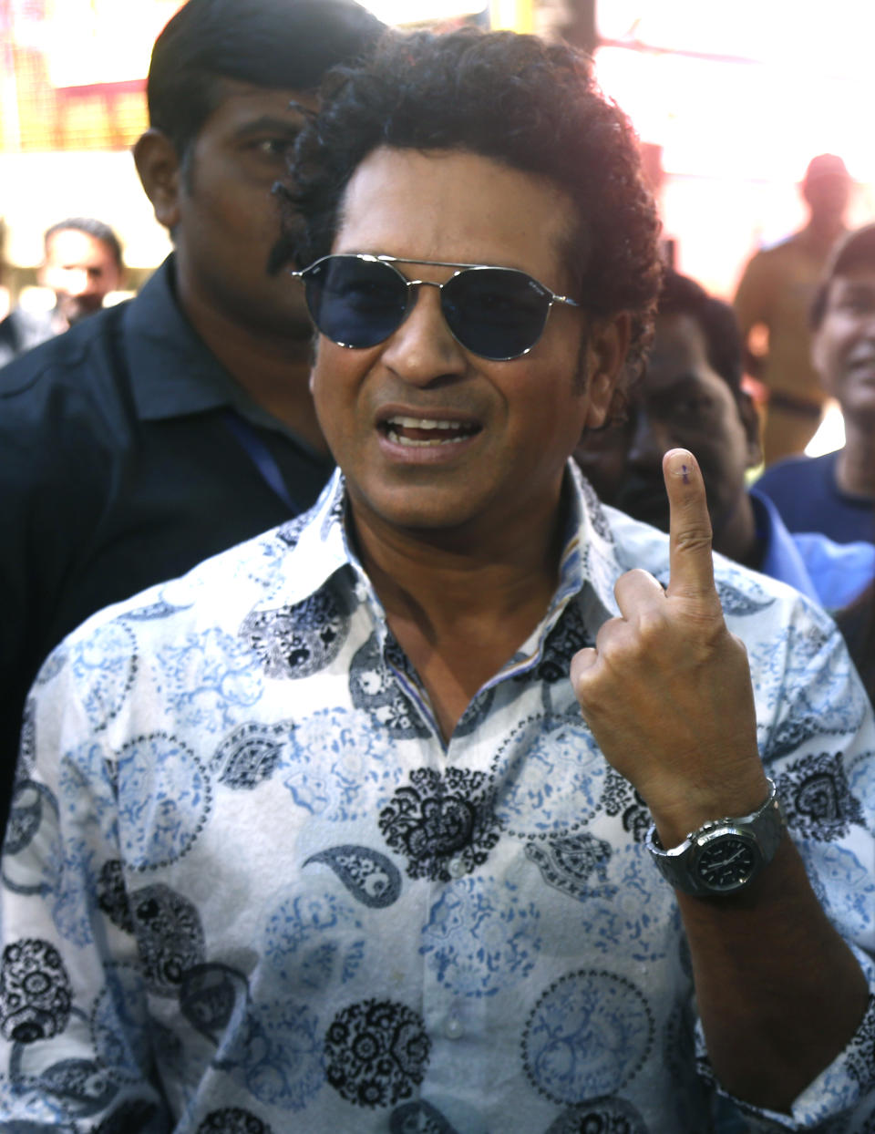 Former Indian cricketer Sachin Tendulkar poses for media after casting his votes in Mumbai, India, Monday, Oct. 21, 2019. Voting is underway in two Indian states of Maharashtra in the west and Haryana in the north where the Hindu nationalist Bharatiya Janata Party (BJP) headed by prime minister Narendra Modi is trying to win a second consecutive term. (AP Photo/Rafiq Maqbool)