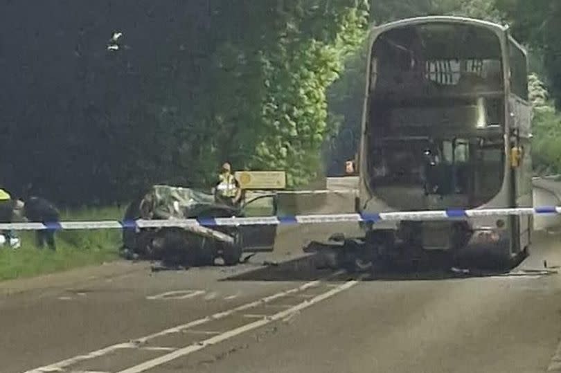 Images from the scene where a bus and car have been involved in a head-on collision