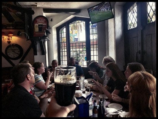 Fans watching soccer at the Blue Anchor Pub in Delray Beach.