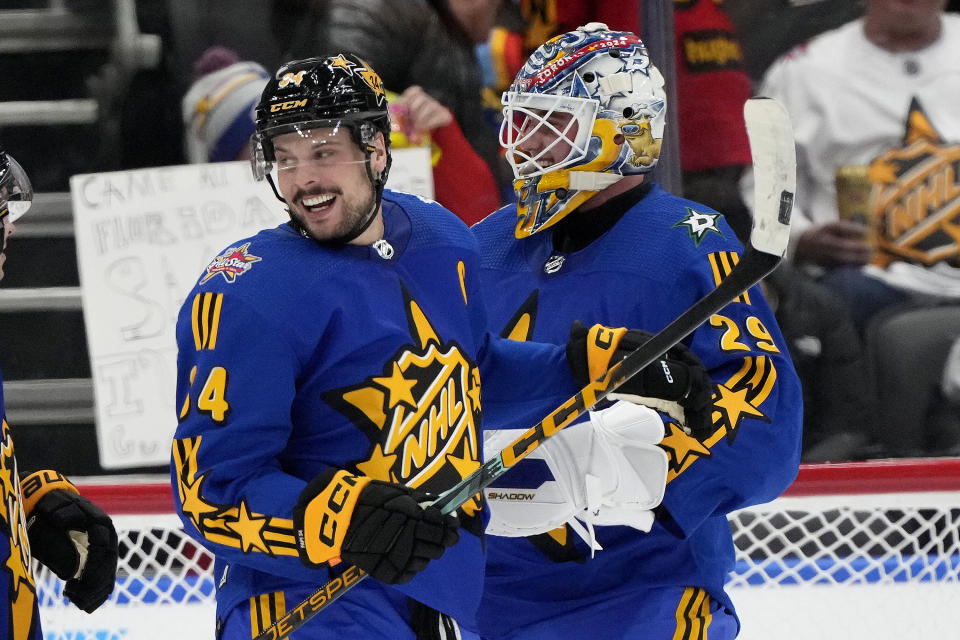 NHL All-Star Team Matthews captain forward Auston Matthews (34), of the Toronto Maple Leafs, and teammate Jake Oettinger (29), of the Dallas Stars, celebrate after winning hockey's NHL All-Star Game against Team McDavid in Toronto, Saturday, Feb. 3, 2024. (Frank Gunn/The Canadian Press via AP)