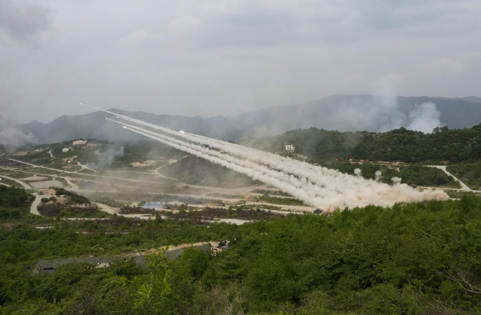 FILE - South Korean army's multiple launch rocket systems fire rockets during a South Korea-U.S. joint military drills at Seungjin Fire Training Field in Pocheon, South Korea, Thursday, May 25, 2023. North Korea on Tuesday, May 30, confirmed plans to launch its first military spy satellite in June and described such capacities as crucial for monitoring the United States' "reckless" military exercises with rival South Korea. (AP Photo/Ahn Young-joon, File)