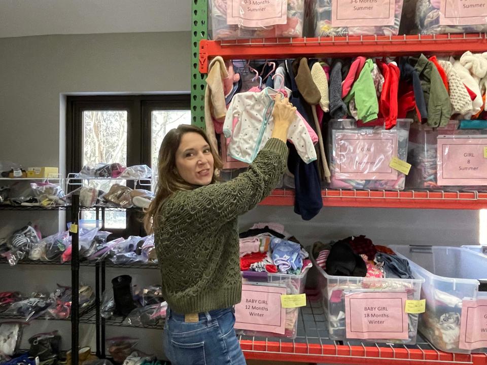 Tess Frear, executive director of Helping Mamas Knoxville, keeps the warehouse well-organized. Dec. 27, 2022.