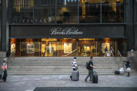 <p>People walk past Brooks Brothers on Church Street across from the World Trade Center site in New York City on Aug. 16, 2017. (Photo: Gordon Donovan/Yahoo News) </p>