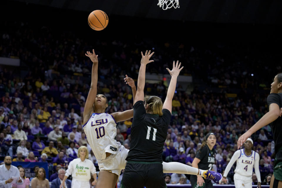 LSU forward Angel Reese (10) shoots against Hawaii forward Kallin Spiller (11) during the second half of a first-round college basketball game in the women's NCAA Tournament in Baton Rouge, La., Friday, March 17, 2023. (AP Photo/Matthew Hinton)