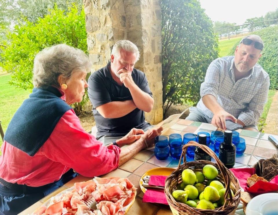 John Shepherd and Jason Donnelly, owners of Mill City Kitchen, in Val d'Orcia in Tuscany with olive oil supplier Donata Origo of Chirantan Olive Oil.