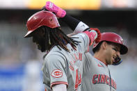 Cincinnati Reds' Elly De La Cruz, left, celebrates with teammate Spencer Steer after hitting a home run during the first inning of a baseball game against the San Diego Padres, Monday, April 29, 2024, in San Diego. (AP Photo/Gregory Bull)