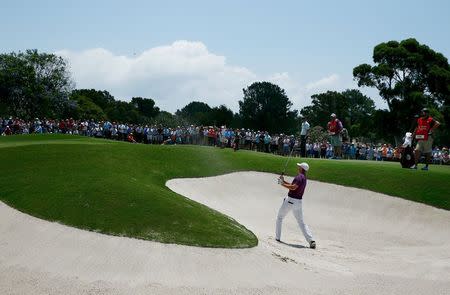 Jordan Spieth of the U.S. chips out of a bunker to the 2nd green during the final round of the 2015 Emirates Australian Open golf tournament in Sydney, Australia, November 29, 2015. REUTERS/Steve Christo