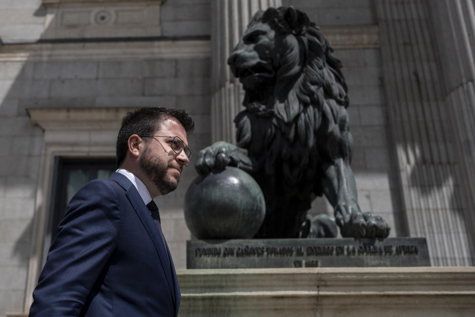 FILE - Catalan President Pere Aragones walks in front of the Spanish Parliament in Madrid, Spain, on April 21, 2022. Spain’s Parliament is set to allow its national legislators to use the country’s minority languages of Catalan, Basque and Galician in the national Parliament for the first time on Tuesday, Sept. 19, 2023. (AP Photo/Manu Fernandez, File)