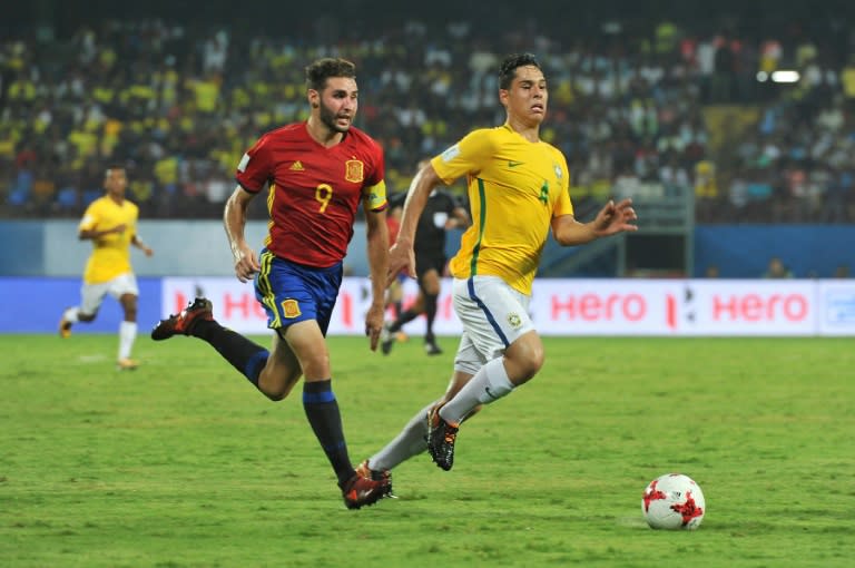 Spain's Abel Ruiz (L) fights for the ball with Brazil's Lucas Halter during their FIFA U-17 World Cup group stage match, at the Jawaharlal Nehru International Stadium in Kochi, on October 7, 2017