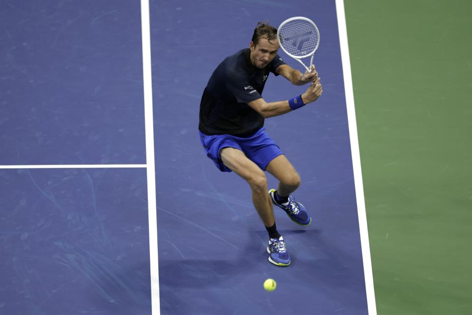 Daniil Medvedev, of Russia, returns a shot to Nick Kyrgios, of Australia, during the fourth round of the U.S. Open tennis championships, Sunday, Sept. 4, 2022, in New York. (AP Photo/Adam Hunger)