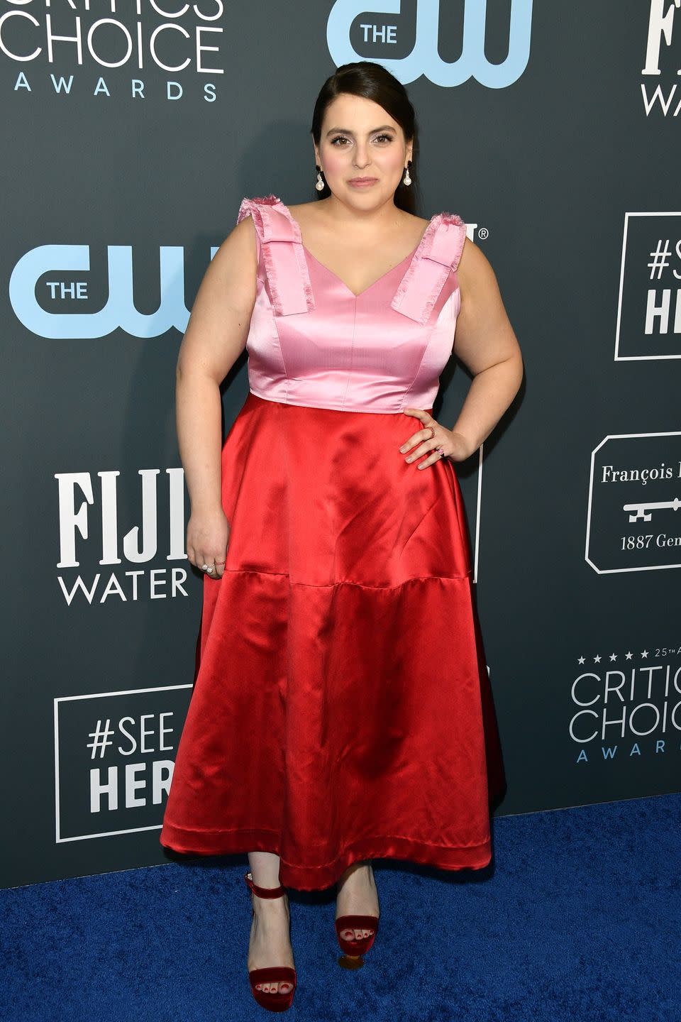 <p>Beanie Feldstein looks trendy in this pink-and-red dress.</p>