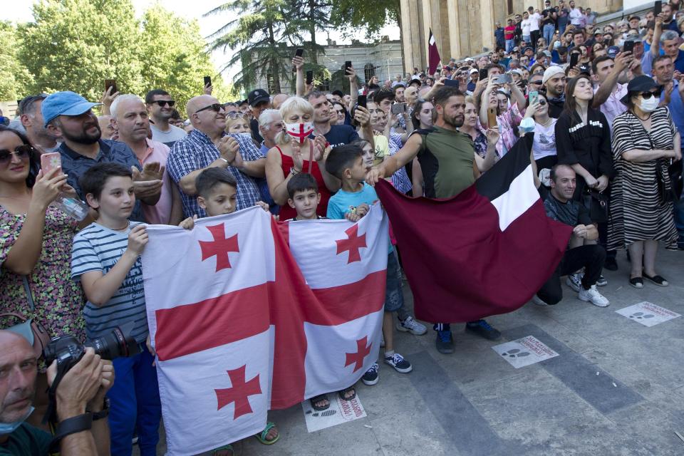 Opponents of the march block off the capital's main avenue to an LGBT march in Tbilisi, Georgia, Monday, July 5, 2021. A protest against a planned LGBT march in the Georgian capital turned violent on Monday as demonstrators attacked journalists. Organizers of the Tbilisi March For Dignity that was to take place in the evening cancelled the event, saying authorities had not provided adequate security guarantees. (AP Photo/Shakh Aivazov)