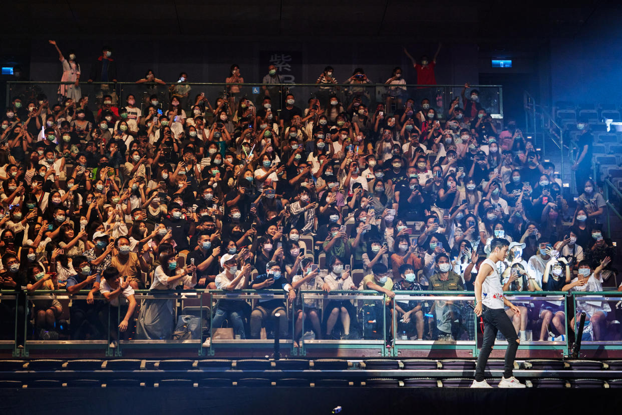 Chou walks on an extended stage that brought him close to fans. At the start of the event, the artist asked attendees to keep their masks on throughout the concert. “If you want to sing, you can still sing!” he said. “Don’t let the masks stop you.” He led the audience in an exercise to practice screaming through their face coverings: “Three, two, one!” he counted down, and more than 10,000 fans proved that their masks were no match for a crowd hungry for the transcendent experience of being collectively immersed in live music. Chou’s concert is the first in the world since the Covid-19 pandemic struck worldwide. Taipei, Taiwan. August, 8th, 2020 Photograph by An Rong Xu for TIME