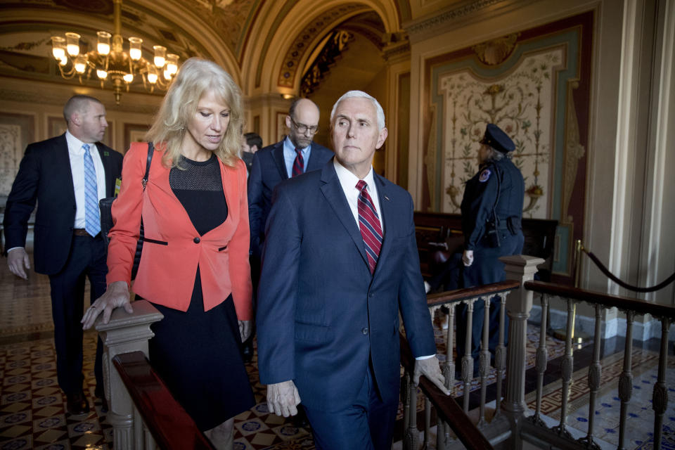 In this Jan. 10, 2019, photo, Vice President Mike Pence and counselor to the President Kellyanne Conway, leave Pence's office off the Senate floor in the Capitol building in Washington. (AP Photo/Andrew Harnik)