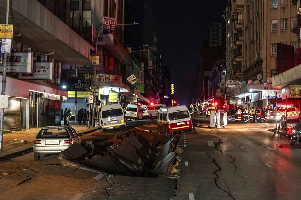 Emergency services gather at the scene of a gas explosion downtown Johannesburg, South Africa, Wednesday July 19, 2023. Search and rescue officials also ordered residents in nearby buildings to evacuate the area and the area where the explosion happened was cordoned off. (AP Photo/ Shiraaz Mohamed)