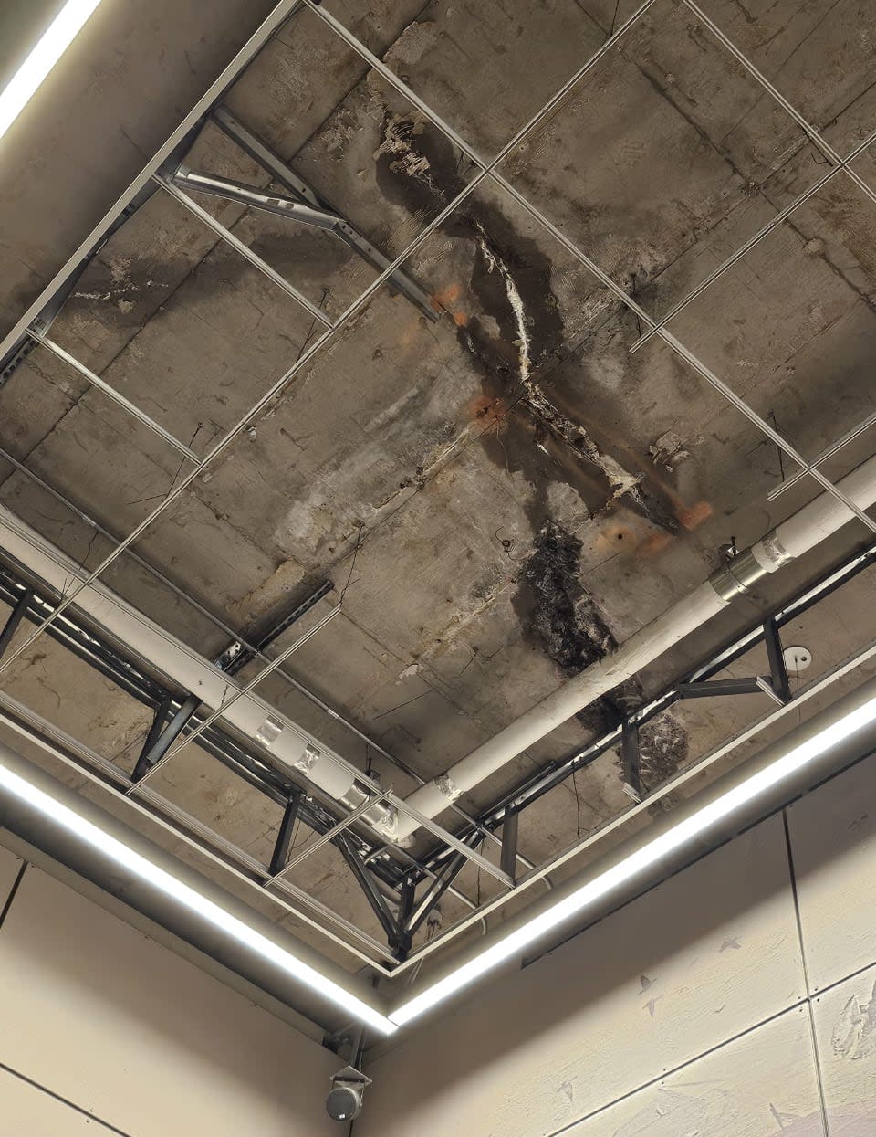 A photo contained in a freedom of information request about the St-Laurent LRT station's latest issue in May 2024, when ceiling tiles were found 'disrupted' and inspectors discovered further concrete separating from the roof slab.