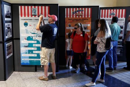 Attendees look at a newly opened exhibit at Ellis Island highlighting the immigrant history behind the "Hot Dog" in New York City, U.S., June 28, 2017. REUTERS/Lucas Jackson