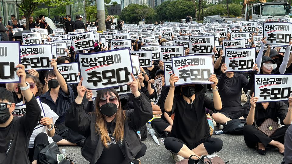 South Korean teachers holding signs that call for "truth," to commemorate the death of a teacher, in Seoul on September 4. - Yoonjung Seo/CNN