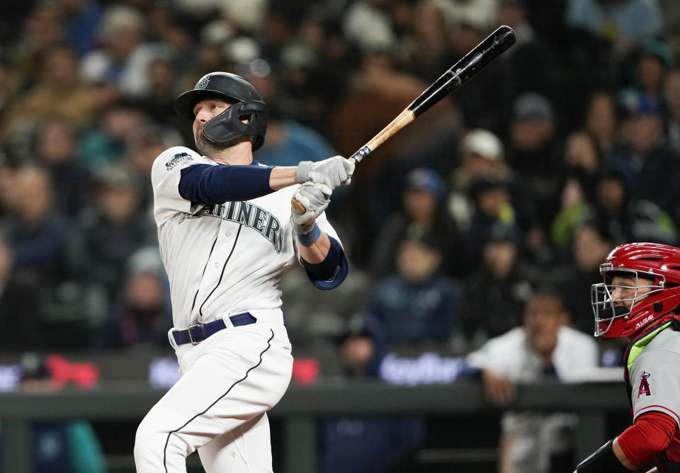 Seattle Mariners' AJ Pollock follows through on a two-run home run, his second home run of the night, during the seventh inning against the Los Angeles Angels in a baseball game Tuesday, April 4, 2023, in Seattle. (AP Photo/Lindsey Wasson)
