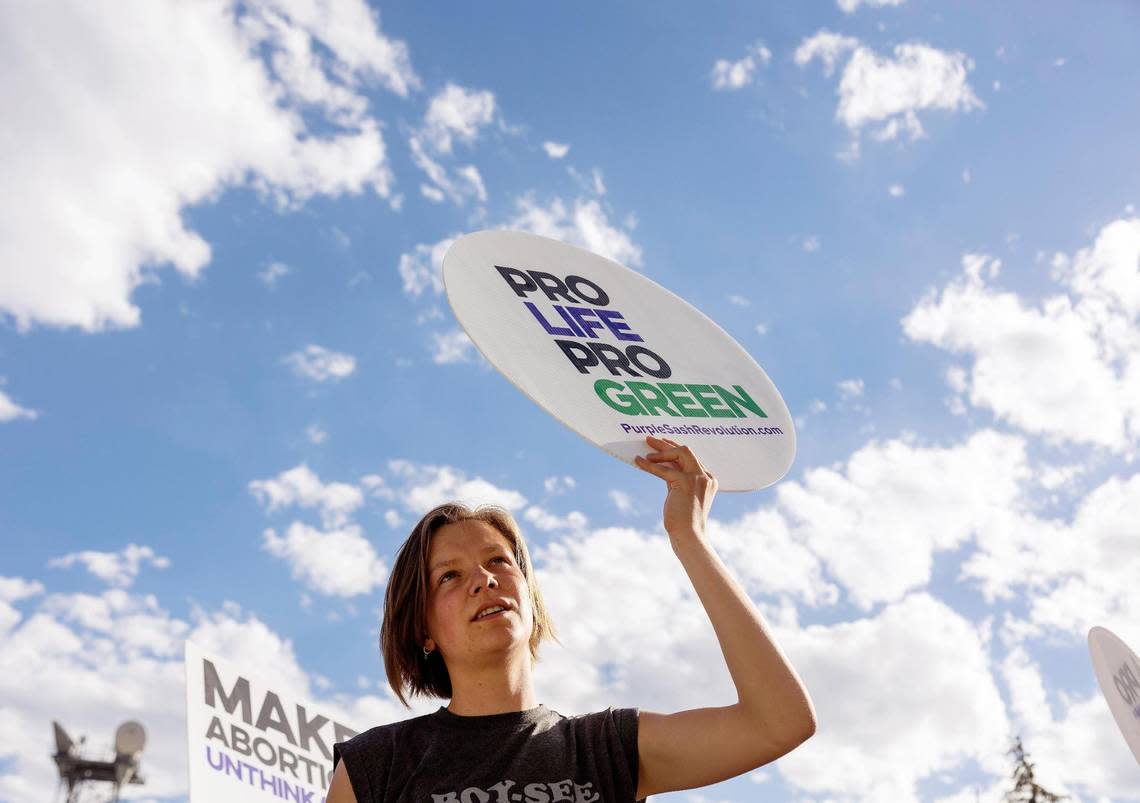 Roma Versluys holds up a pro-life sign during a celebration for the overturn of Roe v. Wade, held outside of the Idaho Statehouse in Boise on Tuesday, June 28, 2022.