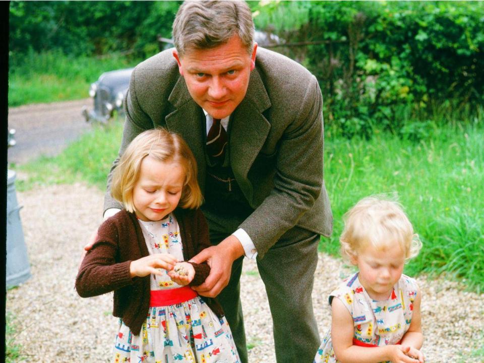 Adams with his daughters Juliet (left) and Ros (right) whom he used to entertain with his stories on car journeys or at bedtime