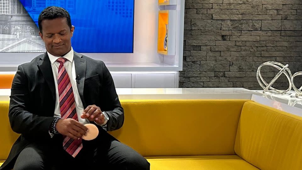 Dr. Mathew getting ready at CNN's studios in Atlanta for a segment last May. He's been a medical analyst at the network since 2020. - Courtesy Saju Mathew