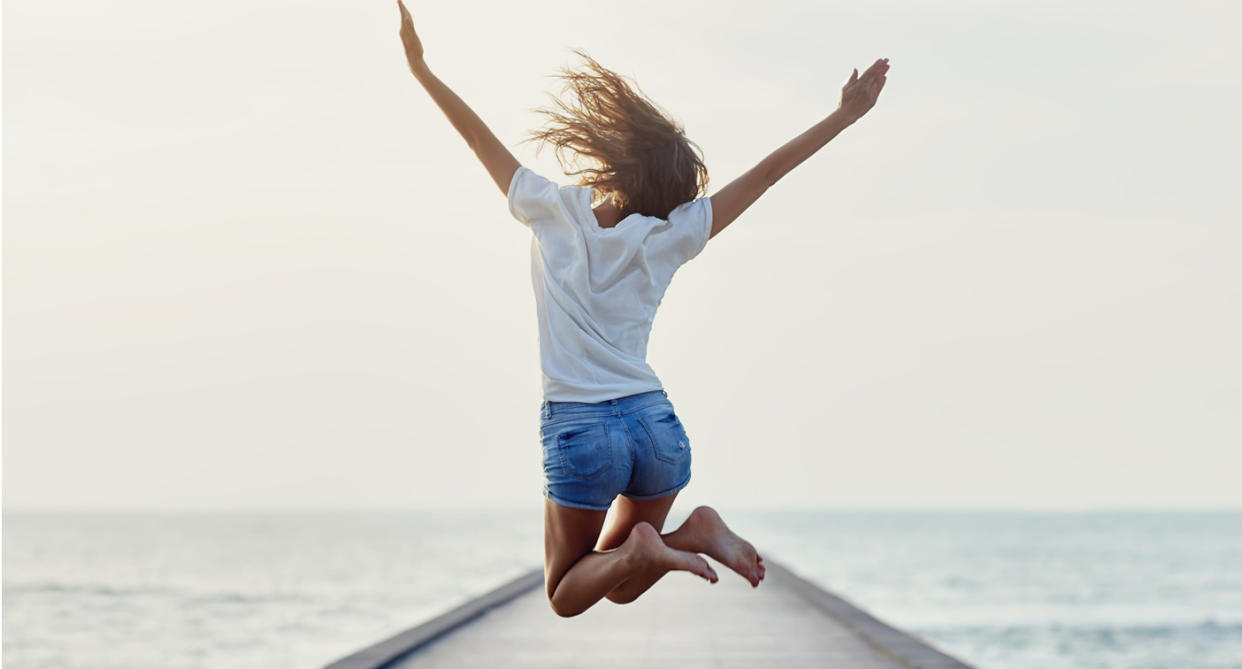 Woman jumping, to show happiness in body. (Getty Images)