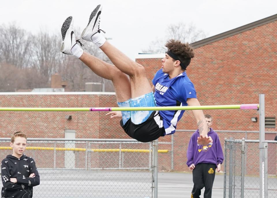 Adrian's Joe Francis competes in the high jump at Onsted's Early Bird Invite on Wednesday.