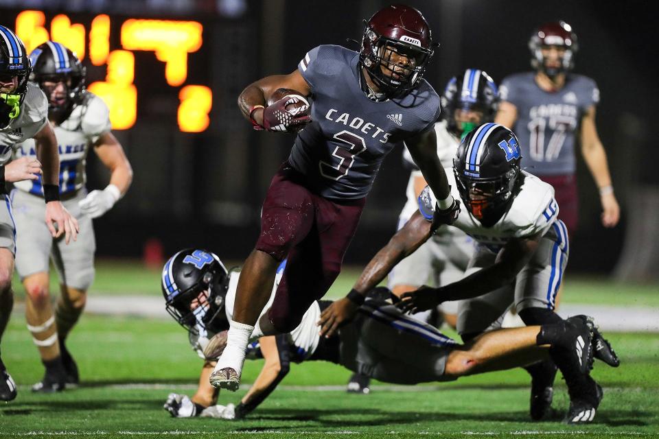Benedictine's Bryce Baker runs for a 30-yard touchdown in a playoff win over LaGrange on Nov. 17, 2023 at Memorial Stadium.