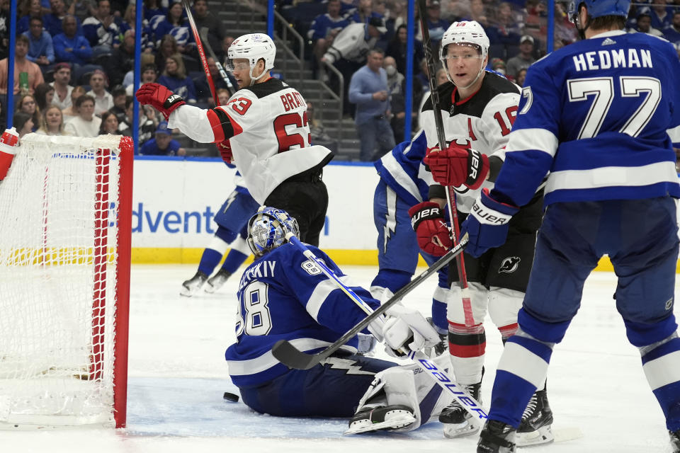 New Jersey Devils left wing Ondrej Palat (18) celebrates after scoring past Tampa Bay Lightning goaltender Andrei Vasilevskiy (88) during the third period of an NHL hockey game Saturday, Jan. 27, 2024, in Tampa, Fla. (AP Photo/Chris O'Meara)