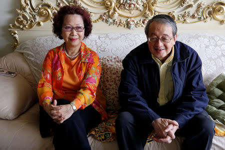Taiwanese independence supporter Paul Lin (R) and his wife Marie Yang pose for a photo in their apartment in Taipei, Taiwan January 27, 2019. Picture taken January 27, 2019. REUTERS/Tyrone Siu