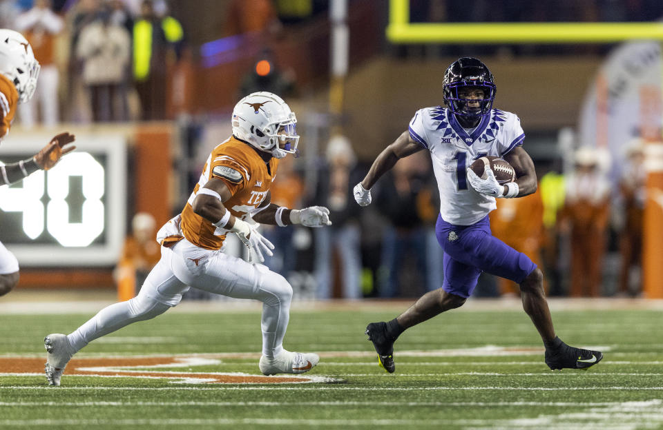 Texas defensive back Jahdae Barron (23) tracks TCU wide receiver Derius Davis (11) during the first half of an NCAA college football game Saturday, Nov. 12, 2022, in Austin, Texas. (AP Photo/Stephen Spillman)