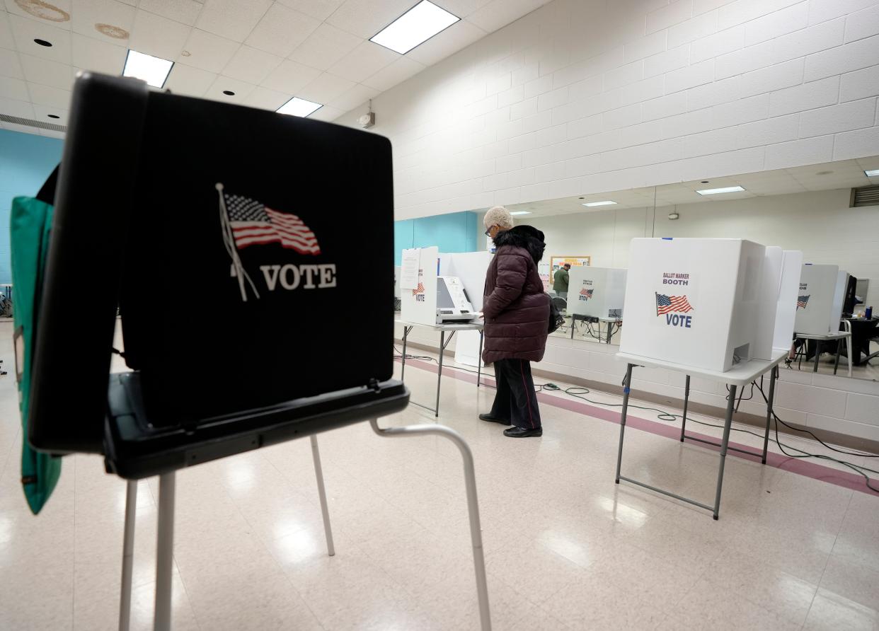 A woman votes at Blackburn Recreation Center in Columbus during Ohio's March 19 primary.
