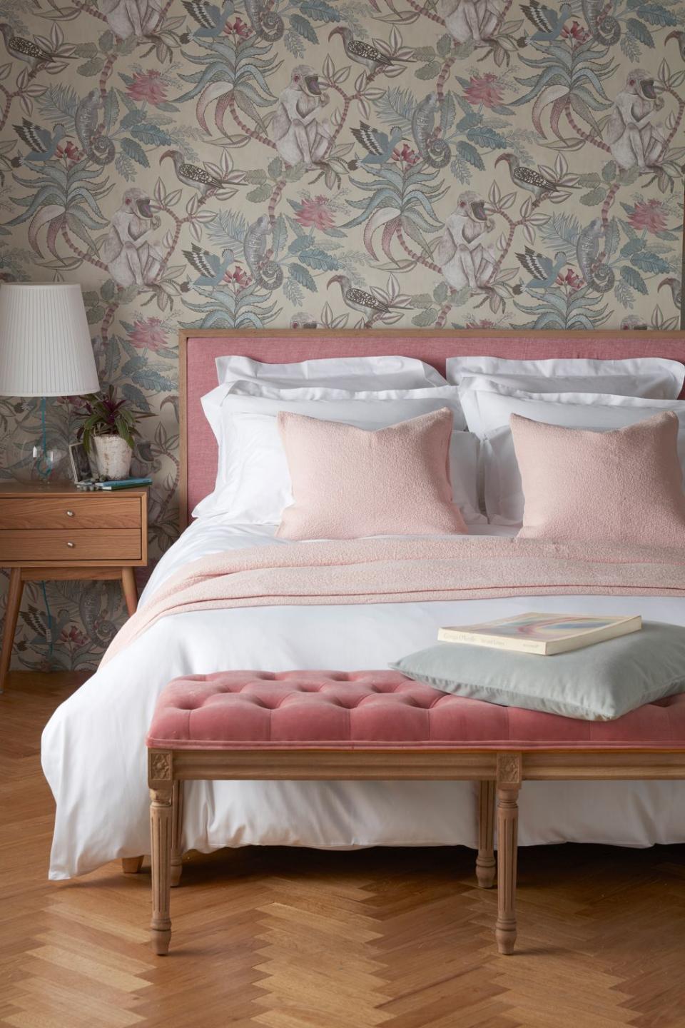 <p> If you are confident in the atmosphere you want to create in your space, a bedroom wallpaper trend can be a quick and cheap way to bring in the right colors and patterns. Use the colors within your wallpaper to dictate the rest of your room &#x2013; we adore how the subtle pink hues work with the gorgeous bed set up here. </p>