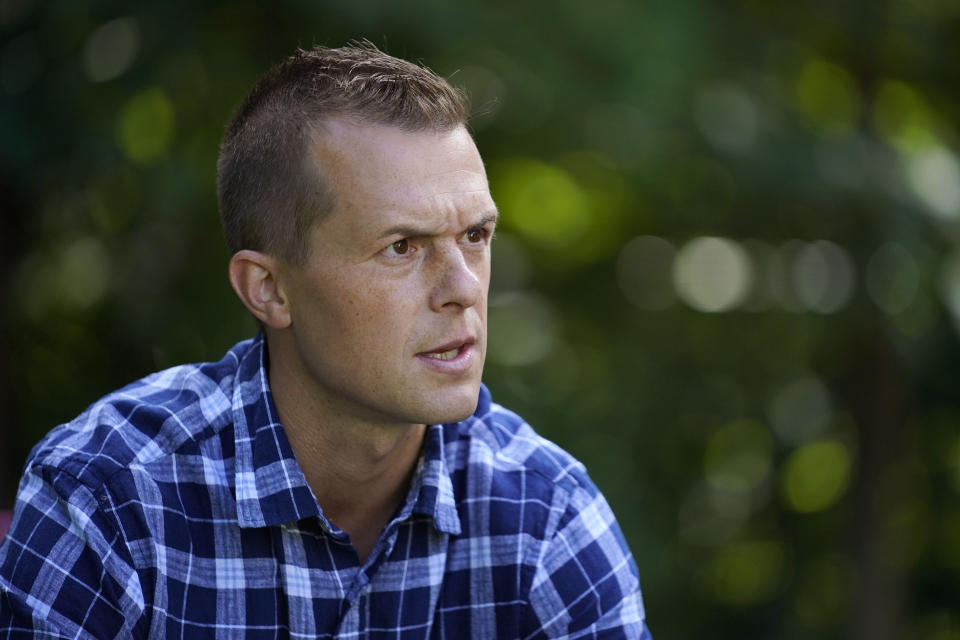 U.S. Rep. Jared Golden, D-Maine, speaks to a reporter at his home, Thursday, Sept. 1, 2022, in Lewiston, Maine. Golden is being challenged by Republican Bruce Poliquin in the November election. (AP Photo/Robert F. Bukaty)