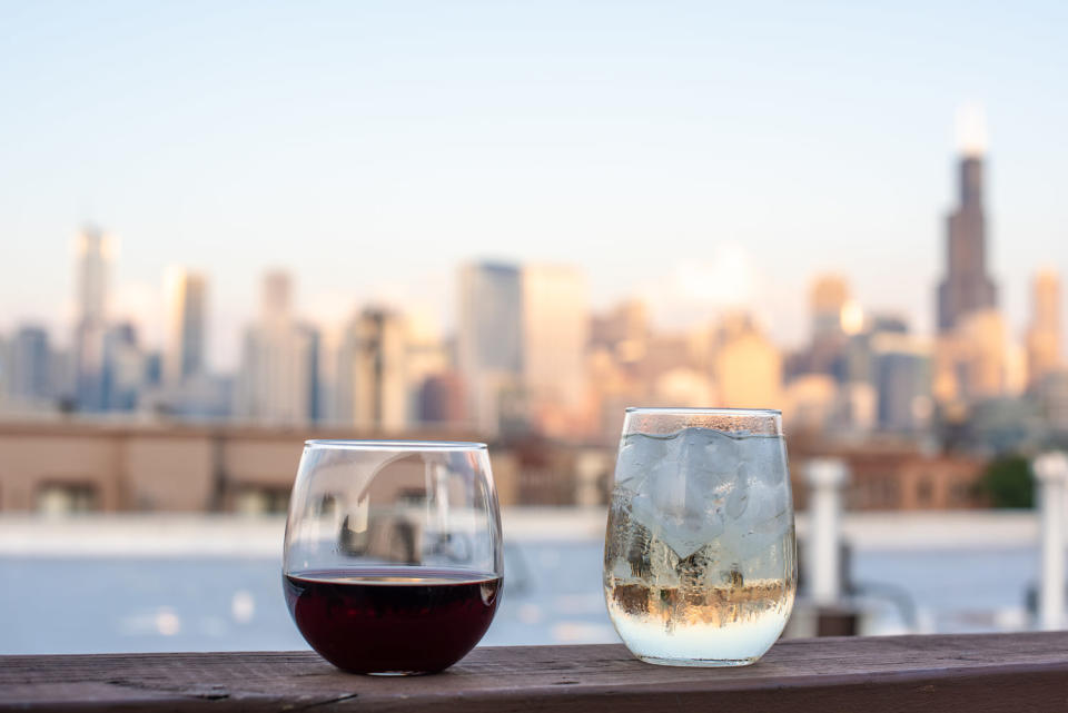 Wine glasses on a rooftop in the city (Page Light Studios / Getty Images/iStockphoto)