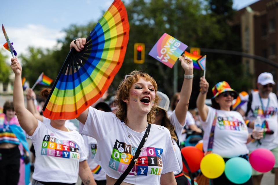 Participants walk during the 2023 Utah Pride Parade in downtown Salt Lake City on Sunday.