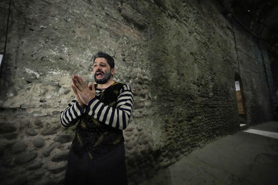 Singer and actor Yusif Eyvazov gestures as he answer questions to the Associated Press prior to perform in 'I Pagliacci' (The Clowns) lyric opera, at the Arena di Verona theatre, in Verona, Italy, Friday, June 25, 2021. The Verona Arena amphitheater returns to staging full operas for the first time since the pandemic struck but with one big difference. Gone are the monumental sets that project the scene to even nosebleed seats in the Roman-era amphitheater, replaced by huge LED screens with dynamic, 3D sets that are bringing new technological experiences to the opera world. (AP Photo/Luca Bruno)