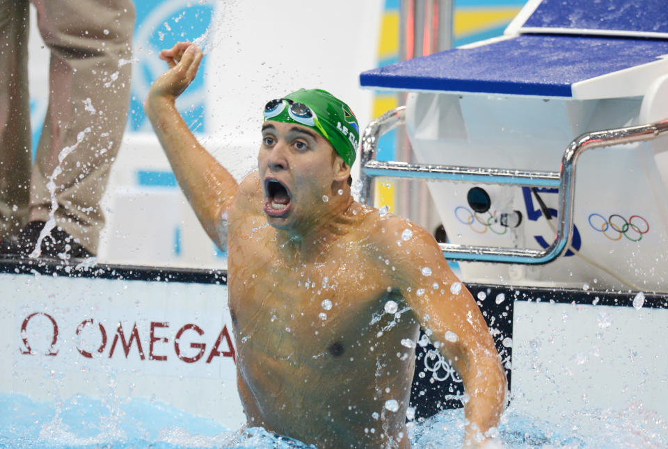 Chad le Clos of South Africa reacts to winning in the men's 200m butterfly final at the Aquatic Centre during the Olympic Games in London, Tuesday, July 31, 2012. (AAP Image/Tracey Nearmy) NO ARCHIVING