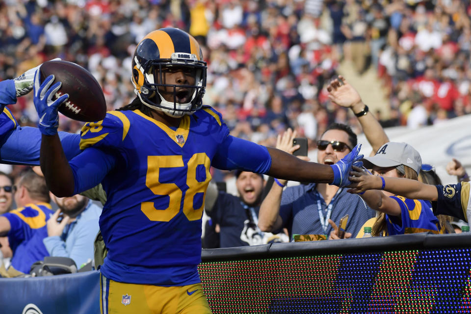 Los Angeles Rams inside linebacker Cory Littleton celebrates after scoring on a interception against the San Francisco 49ers during the first half in an NFL football game Sunday, Dec. 30, 2018, in Los Angeles. (AP Photo/Mark J. Terrill)