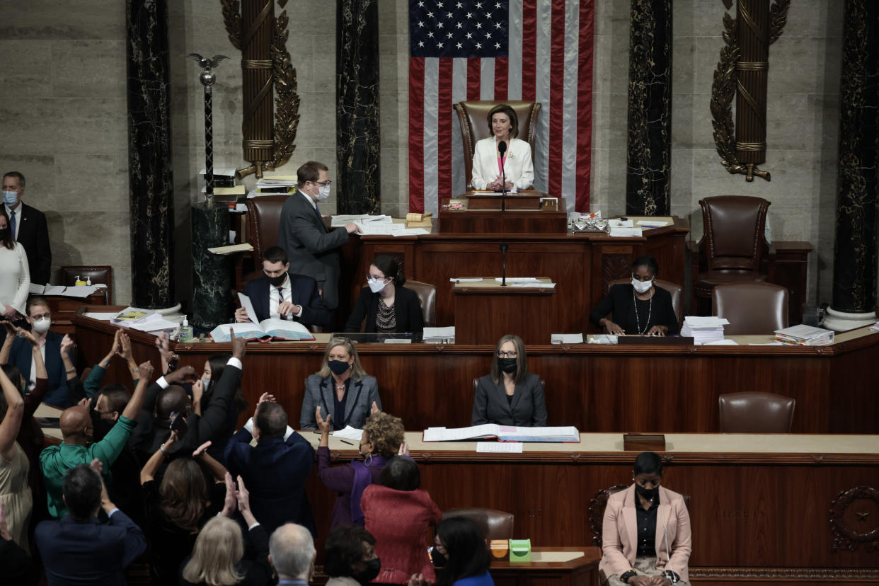 WASHINGTON, DC - NOVEMBER 19: Speaker of the House Nancy Pelosi (D-CA) looks on as House Democrats react to the passage of the Build Back Better Act at the U.S. Capitol on November 19, 2021 in Washington, DC. The vote, which passed 220-213, comes after House Minority Leader Kevin McCarty (D-CA) spoke overnight for more than eight hours in an attempt to convince colleagues not to support the $1.75 trillion social spending bill. The key Biden Administration legislation is the result of months of negotiations between the White House and moderate and progressive House Democrats. (Photo by Anna Moneymaker/Getty Images)