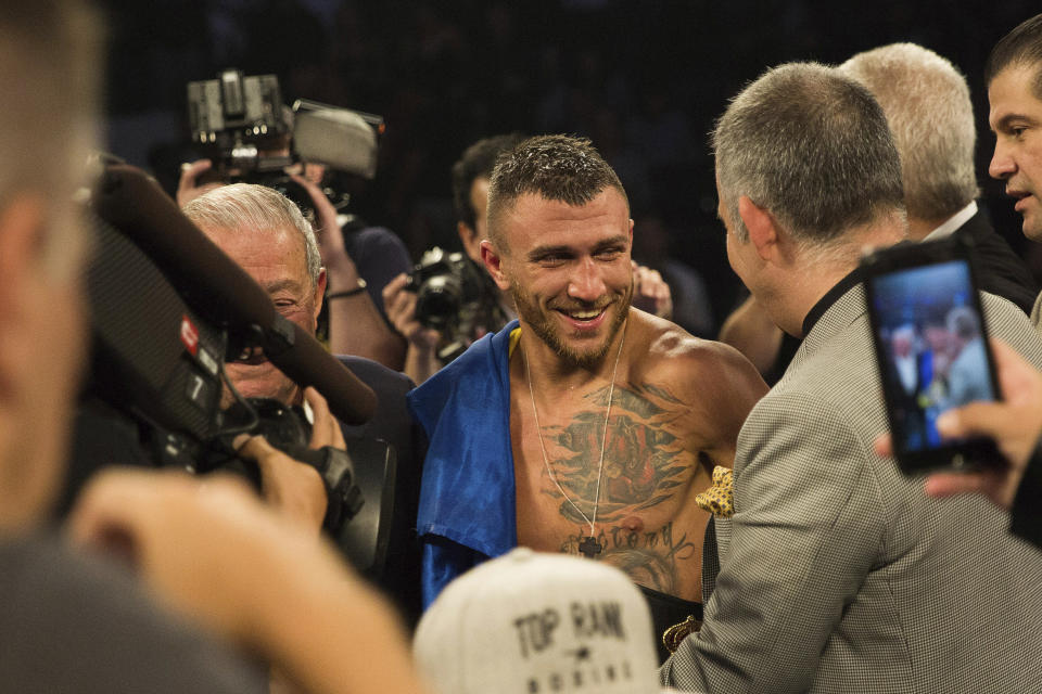 Vasiliy Lomachenko smiles after his victory against Jorge Linares, of Venezuela, during their WBA lightweight championship boxing match Saturday, May 12, 2018, in New York. (AP Photo)