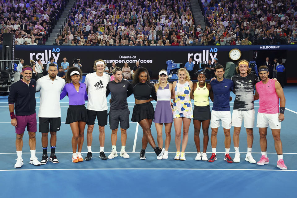 In this Jan. 15, 2020, photo, from left, Roger Federer of Switzerland, Nick Kyrgios of Australia, Naomi Osaka of Japan, Alexander Zverev, Dominic Thiem of Austria, Serena Williams of the United States, Caroline Wozniacki of Denmark, Petra Kvitova of the Czech Republic, Coco Gauff of the United States, Novak Djokovic of Serbia, Stefanos Tsitsipas of Greece and Rafael Nadal of Spain pose for a photo during the Rally For Relief at Rod Laver Arena in Melbourne. Tennis stars have come together for the Rally for Relief to raise money in aid of the bushfire relief efforts across Australia. (Scott Barbour/AAP Image via AP, File)