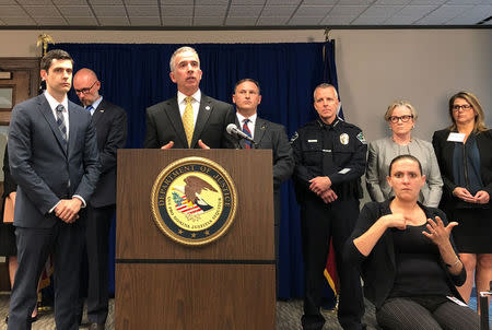 U.S. ATF agent Fred Milanowski with U.S. Attorney John Bash (L) looking on, speaks about March 2018 Austin serial bombings at a news conference in Austin, Texas, U.S., April 9, 2018. REUTERS/Jon Herskovitz