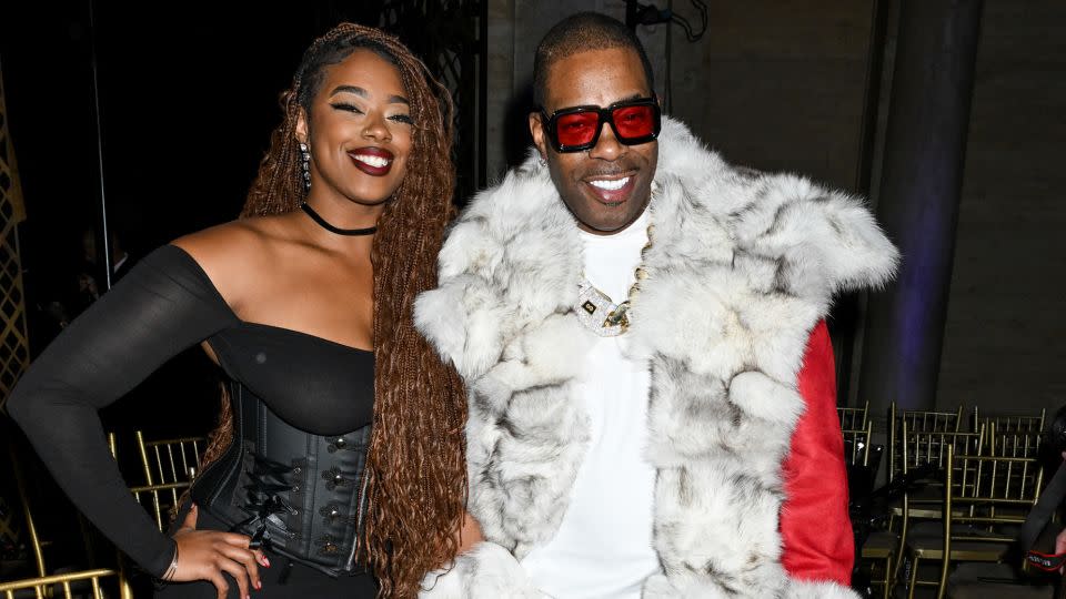 Cacie Smith and Busta Rhymes at LaQuan Smith. - Gilbert Flores/WWD/Getty Images