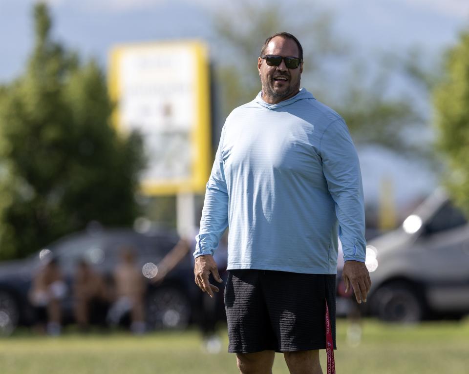 Mike Wilson talks with players while watching his son Isaac Wilson during a 7-on-7 passing league game in Layton on Friday, June 9, 2023. | Scott G Winterton, Deseret News