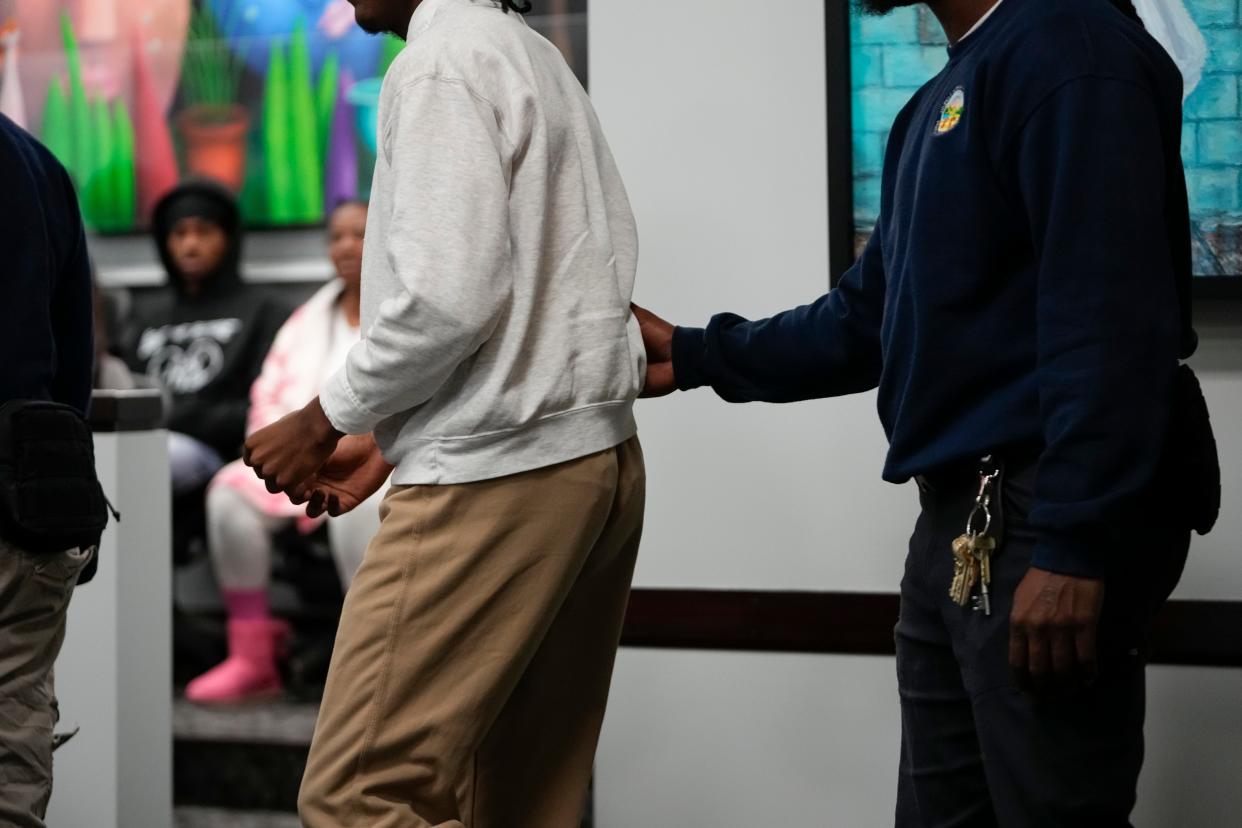 Terrell Hicks-Freeman, 16, who is charged with two murders, is led into Franklin County Juvenile Court on Oct. 10, 2023.  Terrell and Baron Anderson are accused of getting their friend Makhy Andrews killed and of both shooting Layton Ridgedell on June 3, 2022. Terrell, Baron and Makhy were all 15 at the time.