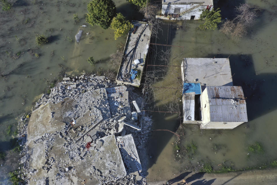 An aerial view of the al-Tlul village flooded after a devastating earthquake destroyed a river dam in the town of Salqeen near the Turkish border, Idlib province, Syria, Thursday, Feb. 9, 2023. (AP Photo/Ghaith Alsayed)