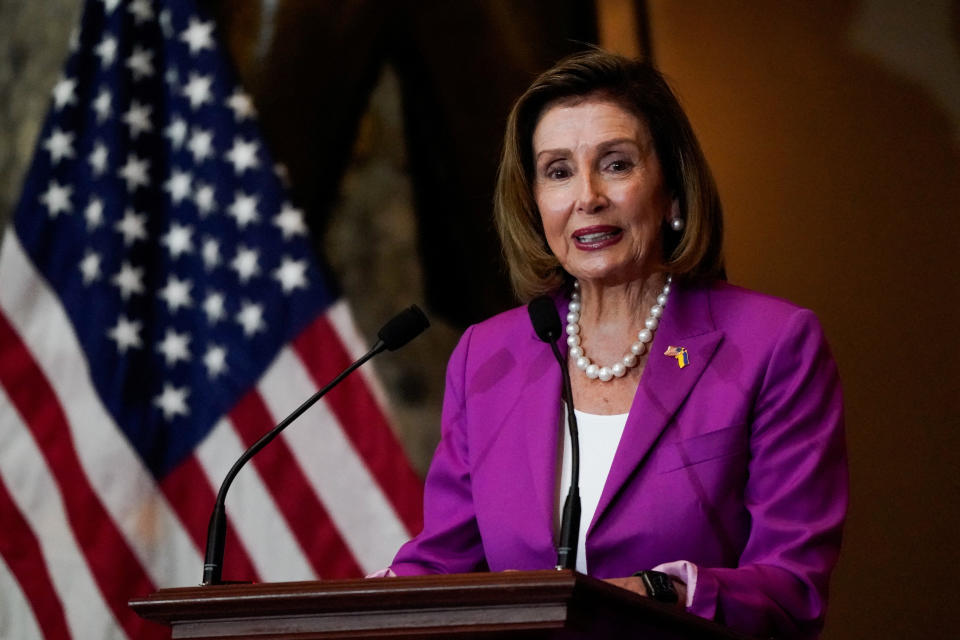 House Speaker Nancy Pelosi stands at a podium and speaks at the U.S. Capitol.